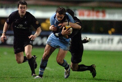 18.11.06 - Cardiff Blues v Connacht - Magners League - Blues' Nicky Robinson is tackled by Keith Matthews 