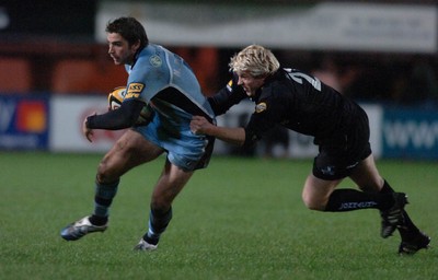 18.11.06 - Cardiff Blues v Connacht - Magners League - Blues' Nicky Robinson is tackled by Mark Mchugh 