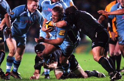 18.11.06  Cardiff Blues v Connacht Cardiff's Xavier Rush is tackled by Adrian Flavin 