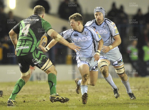 220213 - Cardiff Blues v Connacht - RaboDirect PRO12 - Lewis Jones of Cardiff Blues, flicks the ball away from Connacht's Michael Swift 