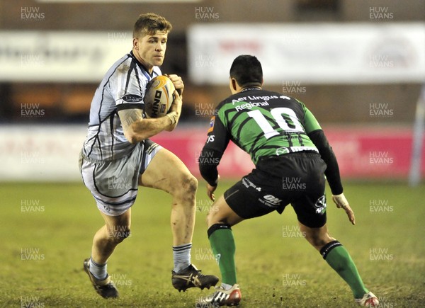 220213 - Cardiff Blues v Connacht - RaboDirect PRO12 - Gavin Evans of Cardiff Blues, left, runs with the ball towards Connacht's Miah Nikora 