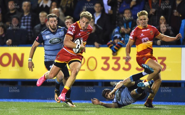 061017 - Cardiff Blues v Dragons Rugby - Guinness PRO14 - Tyler Morgan of Dragons gets past Rhun Williams of Cardiff Blues