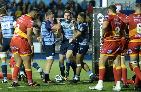 061017 - Cardiff Blues v Dragons Rugby - Guinness PRO14 - Alex Cuthbert of Cardiff Blues celebrates his try with Corey Domachowski and Rey Lee-Lo