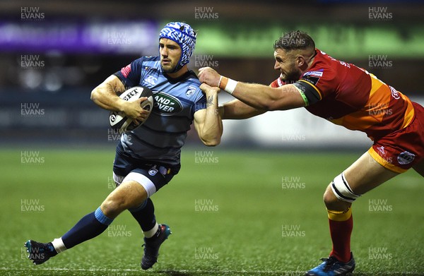 061017 - Cardiff Blues v Dragons Rugby - Guinness PRO14 - Matthew Morgan of Cardiff Blues gets past James Thomas of Dragons