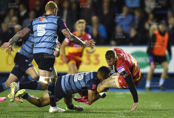 061017 - Cardiff Blues v Dragons Rugby - Guinness PRO14 - Jack Dixon of Dragons is tackled by Willis Halaholo of Cardiff Blues