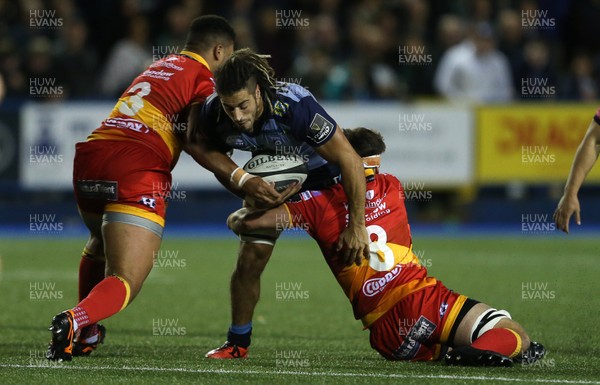 061017 - Cardiff Blues v Dragons Rugby - Guinness PRO14 - Josh Navidi of Cardiff Blues is tackled by Leon Brown and James Benjamin of Dragons