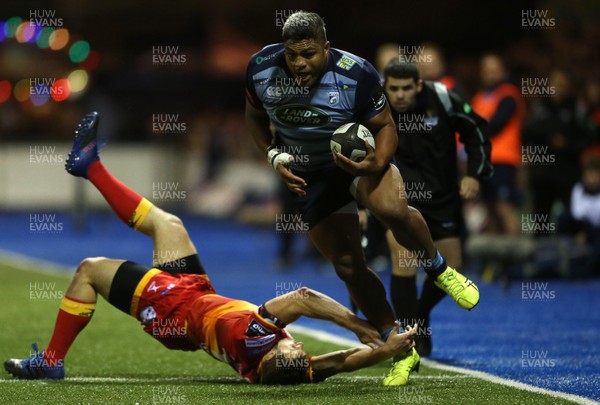 061017 - Cardiff Blues v Dragons Rugby - Guinness PRO14 - Nick Williams of Cardiff Blues smashes past Adam Warren of Dragons