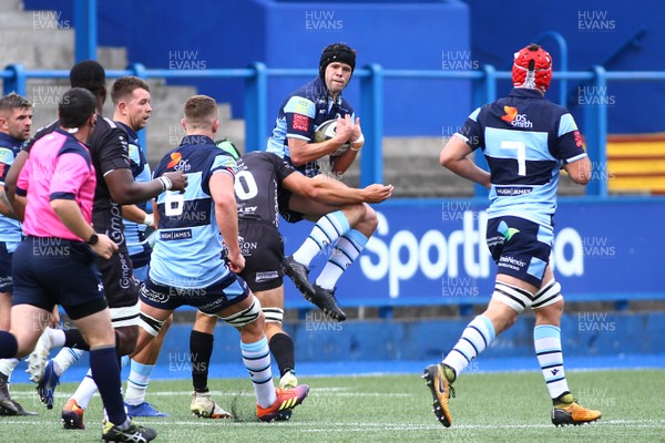 070919 - Cardiff Blues A v Dragons A - Celtic Cup -  Ioan Davies of Cardiff Blues A takes a high ball under pressure from Ollie Griffiths of Dragons A 