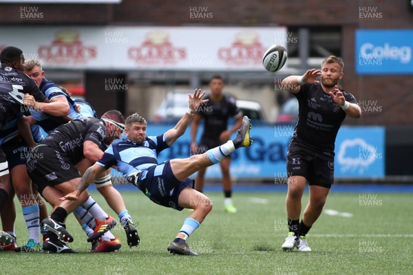 070919 - Cardiff Blues A v Dragons A - Celtic Cup -  Lewis Jones of Cardiff Blues A is tackled by Ryan Bevington of Dragons A 