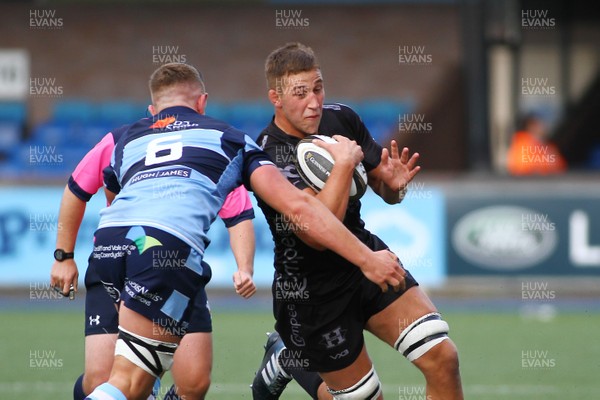 070919 - Cardiff Blues A v Dragons A - Celtic Cup -  Huw Taylor of Dragons A is tackled by Shane Lewis Hughes of Cardiff Blues A