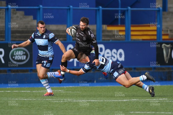 070919 - Cardiff Blues A v Dragons A - Celtic Cup -  Jordan Williams of Dragons A is tackled by Harri Millard of Cardiff Blues A