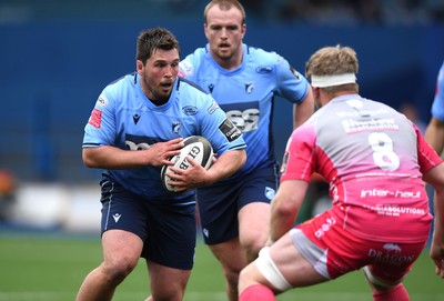 090521 - Cardiff Blues v Dragons - Guinness PRO14 Rainbow Cup - Brad Thyer of Cardiff Blues is tackled by Aaron Wainwright of Dragons