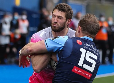 090521 - Cardiff Blues v Dragons, Guinness PRO14 Rainbow Cup - Jonah Holmes of Dragons looks to get past Hallam Amos of Cardiff Blues