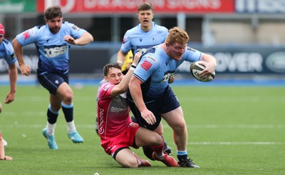 090521 - Cardiff Blues v Dragons, Guinness PRO14 Rainbow Cup - Rhys Carre of Cardiff Blues is brought down by Sam Davies of Dragons