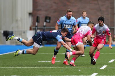 090521 - Cardiff Blues v Dragons, Guinness PRO14 Rainbow Cup - Jason Harries of Cardiff Blues is sent airborne as he tackles Rio Dyer of Dragons