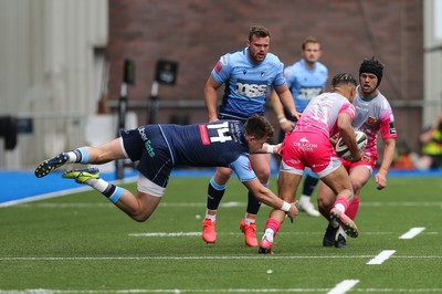 090521 - Cardiff Blues v Dragons, Guinness PRO14 Rainbow Cup - Jason Harries of Cardiff Blues is sent airborne as he tackles Rio Dyer of Dragons