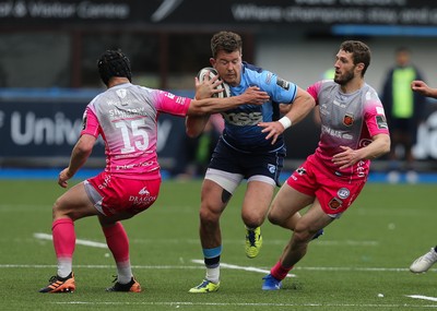 090521 - Cardiff Blues v Dragons, Guinness PRO14 Rainbow Cup - Jason Harries of Cardiff Blues gets past Ioan Davies of Dragons