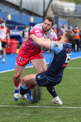 090521 - Cardiff Blues v Dragons, Guinness PRO14 Rainbow Cup - Jonah Holmes of Dragons is tackled by Hallam Amos of Cardiff Blues