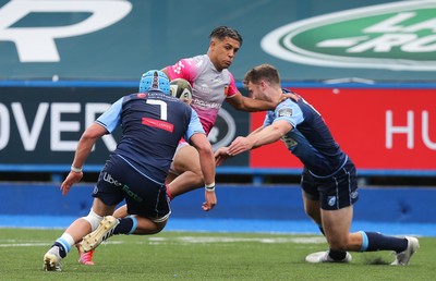 090521 - Cardiff Blues v Dragons, Guinness PRO14 Rainbow Cup - Rio Dyer of Dragons looks for a way between Josh Turnbull of Cardiff Blues and Max Llewellyn of Cardiff Blues