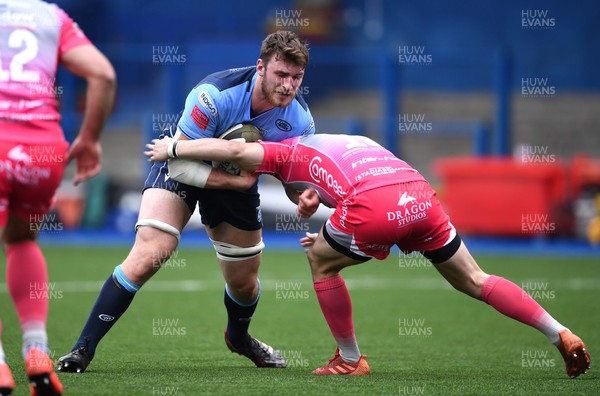 090521 - Cardiff Blues v Dragons - Guinness PRO14 Rainbow Cup - James Ratti of Cardiff Blues is tackled by Sam Davies of Dragons