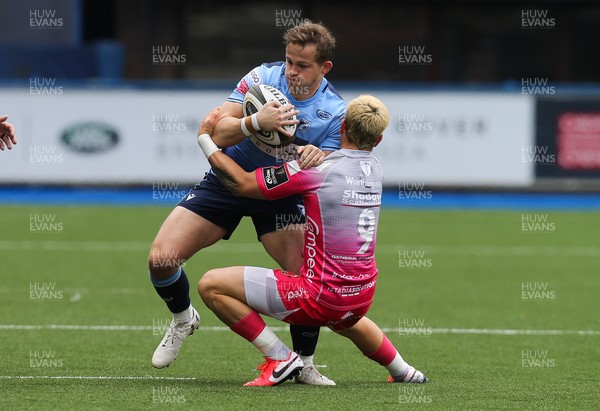 090521 - Cardiff Blues v Dragons, Guinness PRO14 Rainbow Cup - Hallam Amos of Cardiff Blues is tackled by Gonzalo Bertranou of Dragons