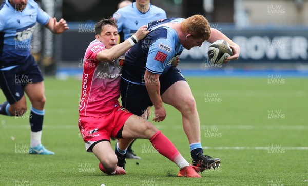 090521 - Cardiff Blues v Dragons, Guinness PRO14 Rainbow Cup - Rhys Carre of Cardiff Blues is brought down by Sam Davies of Dragons