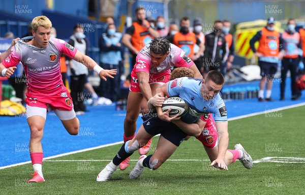 090521 - Cardiff Blues v Dragons, Guinness PRO14 Rainbow Cup - Josh Adams of Cardiff Blues is tackled by Aneurin Owen of Dragons and Rio Dyer of Dragons
