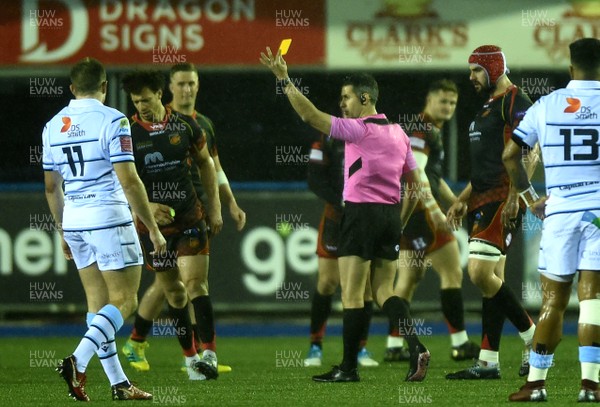 211218 - Cardiff Blues v Dragons Rugby - Guinness PRO14 - Referee Frank Murphy shows Zane Kirchner of Dragons a yellow card