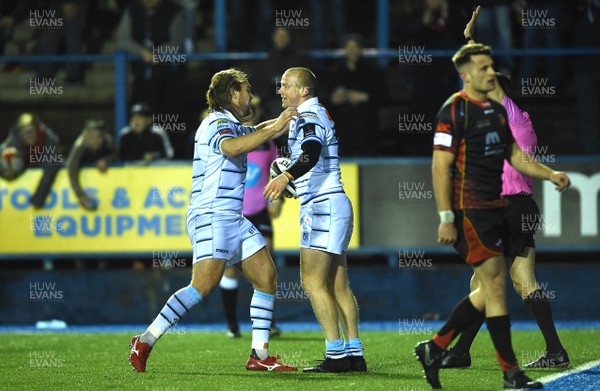 211218 - Cardiff Blues v Dragons Rugby - Guinness PRO14 - Dan Fish of Cardiff Blues celebrates scoring try with Kristian Dacey (left)