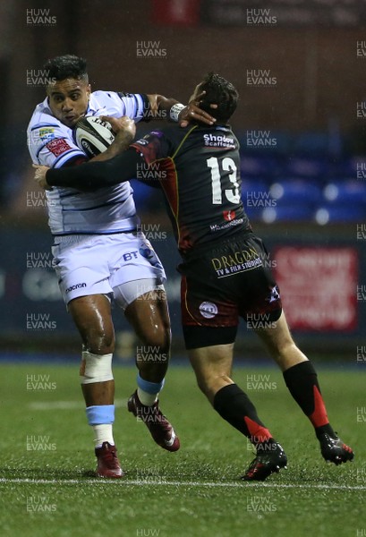 211218 - Cardiff Blues v Dragons - Guinness PRO14 - Rey Lee-Lo of Cardiff Blues is tackled by Adam Warren of Dragons