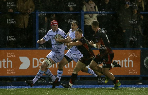 211218 - Cardiff Blues v Dragons - Guinness PRO14 - Seb Davies of Cardiff Blues is tackled by Hallam Amos of Dragons