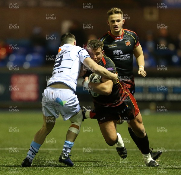 211218 - Cardiff Blues v Dragons - Guinness PRO14 - Elliot Dee of Dragons is tackled by Tomos Williams of Cardiff Blues
