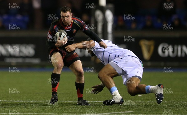 211218 - Cardiff Blues v Dragons - Guinness PRO14 - Adam Warren of Dragons is tackled by Nick Williams of Cardiff Blues