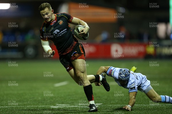211218 - Cardiff Blues v Dragons - Guinness PRO14 - Hallam Amos of Dragons is tackled by Matthew Morgan of Cardiff Blues