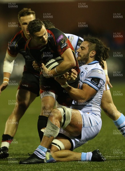 211218 - Cardiff Blues v Dragons - Guinness PRO14 - Jason Tovey of Dragons is tackled by Josh Navidi of Cardiff Blues