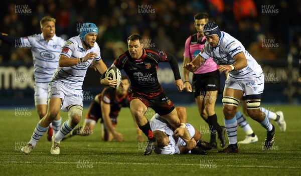211218 - Cardiff Blues v Dragons - Guinness PRO14 - Adam Warren of Dragons is tackled by Scott Andrews of Cardiff Blues