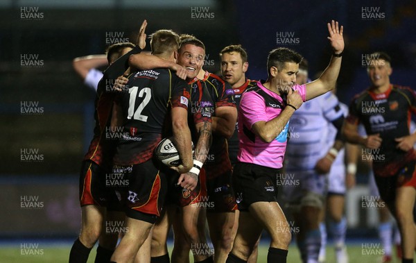 211218 - Cardiff Blues v Dragons - Guinness PRO14 - Jarryd Sage of Dragons celebrates scoring a try with Tavis Knoyle and team mates