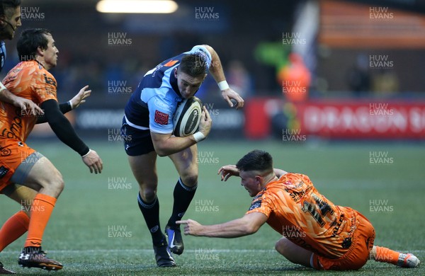 261219 - Cardiff Blues v Dragons - Guinness PRO14 - Josh Adams of Cardiff Blues is tackled by Jared Rosser of Dragons