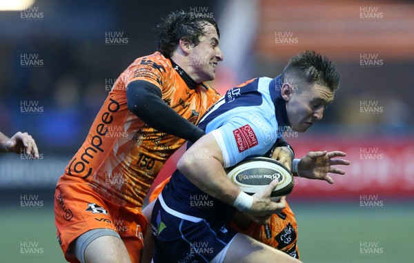 261219 - Cardiff Blues v Dragons - Guinness PRO14 - Josh Adams of Cardiff Blues is tackled by Rhodri Williams of Dragons