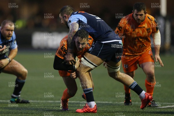 261219 - Cardiff Blues v Dragons - Guinness PRO14 - Sam Davies of Dragons is tackled by Josh Turnbull of Cardiff Blues