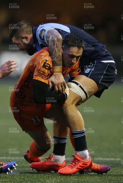 261219 - Cardiff Blues v Dragons - Guinness PRO14 - Sam Davies of Dragons is tackled by Josh Turnbull of Cardiff Blues