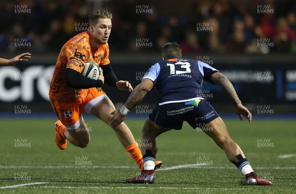 261219 - Cardiff Blues v Dragons - Guinness PRO14 - Tyler Morgan of Dragons is tackled by Rey Lee-Lo of Cardiff Blues