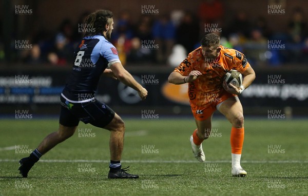 261219 - Cardiff Blues v Dragons - Guinness PRO14 - Elliot Dee of Dragons is tackled by Josh Navidi of Cardiff Blues