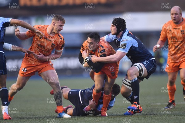 261219 - Cardiff Blues v Dragons - Guinness PRO14 - Sam Davies of Dragons  is tackled by Liam Belcher of Cardiff Blues and James Ratti of Cardiff Blues 