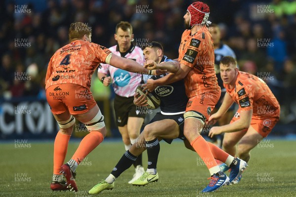 261219 - Cardiff Blues v Dragons - Guinness PRO14 - Tomos Williams of Cardiff Blues is tackled by Cory Hill of Dragons and Matthew Screech of Dragons 