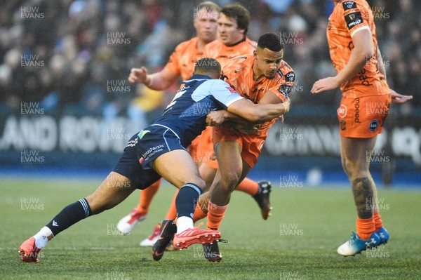 261219 - Cardiff Blues v Dragons - Guinness PRO14 - Ashton Hewitt of Dragons is tackled by Ben Thomas of Cardiff Blues 