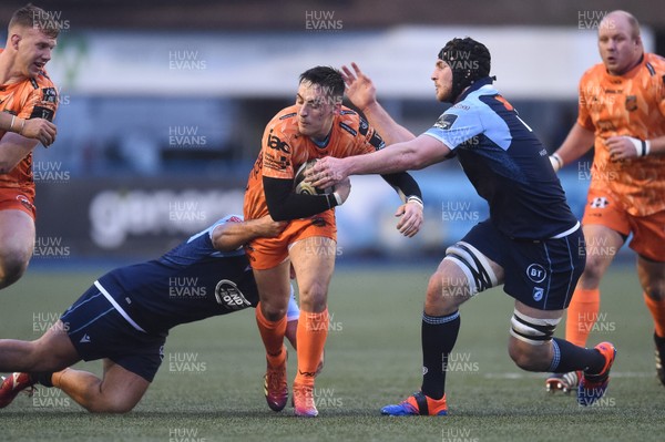261219 - Cardiff Blues v Dragons - Guinness PRO14 - Sam Davies of Dragons is tackled by Liam Belcher of Cardiff Blues and James Ratti of Cardiff Blues 