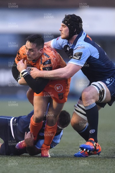 261219 - Cardiff Blues v Dragons - Guinness PRO14 - Sam Davies of Dragons is tackled by Liam Belcher of Cardiff Blues and James Ratti of Cardiff Blues 