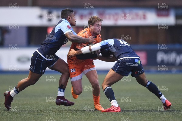 261219 - Cardiff Blues v Dragons - Guinness PRO14 - Tyler Morgan of Dragons is tackled by Rey Lee-Lo of Cardiff Blues  and Ben Thomas of Cardiff Blues 