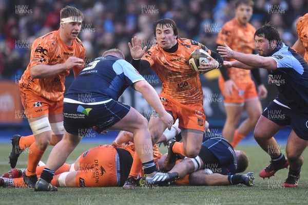 261219 - Cardiff Blues v Dragons - Guinness PRO14 - Rhodri Williams of Dragons is tackled by Keiron Assiratti of Cardiff Blues  and Liam Belcher of Cardiff Blues 